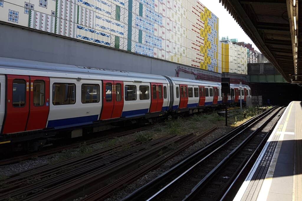 A District Line train leaving a station