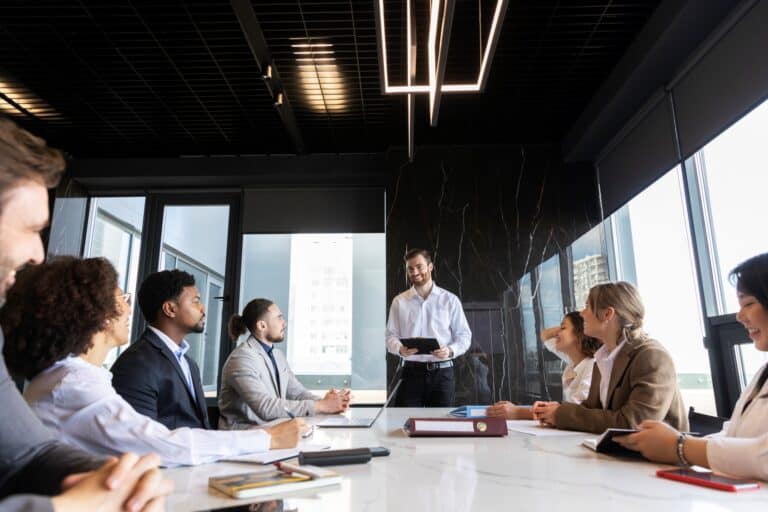 The department heads of a company is in the office relocation meeting in the concept of 'how to inform employees about an office move'.