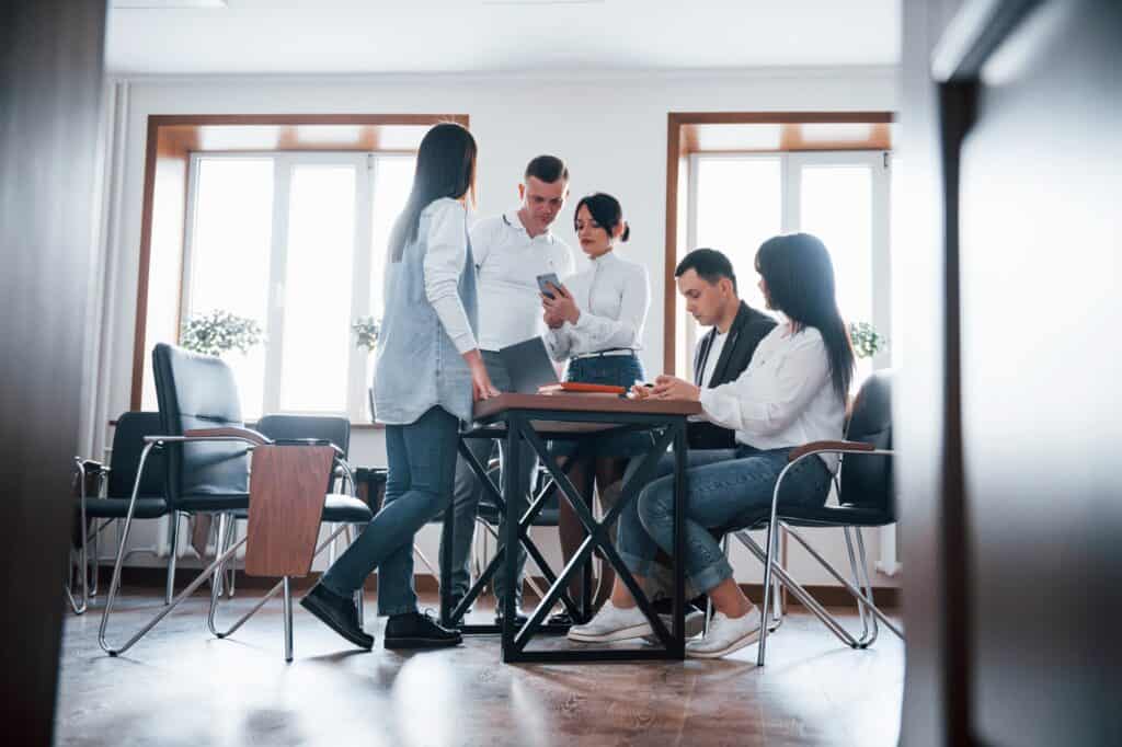 A small team in a feedback session after the move