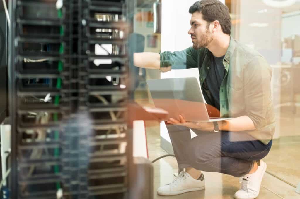 A technician checking the servers post-move